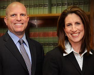 photo of attorneys Laura and Warren Sutnick